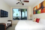 Master Bedroom has private patio access, large walk in closet and views of the pool and beach. 